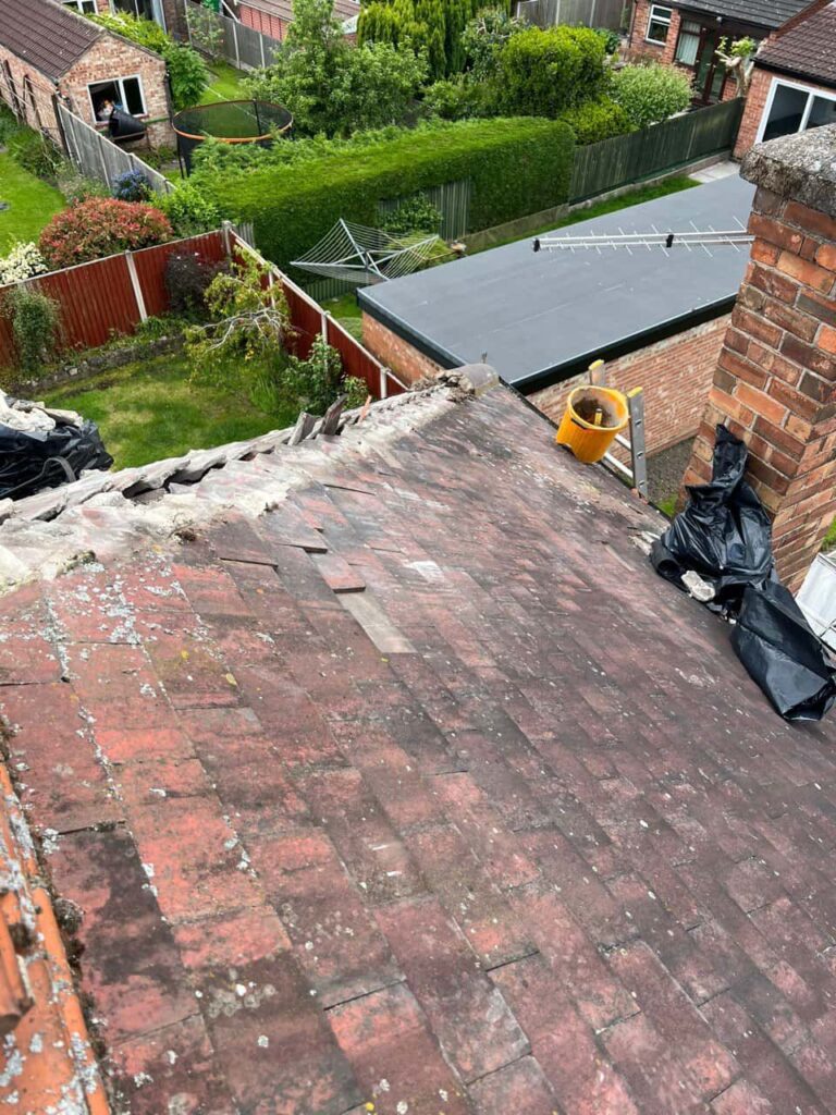 This is a photo of a roof where the hip tiles have been removed, and are just about to be replaced. Works carried out by TRP Roofing Willerby